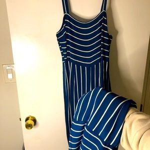 Medium pants suit. Side zip. Pinstripes vertically. Thin shoulder straps.